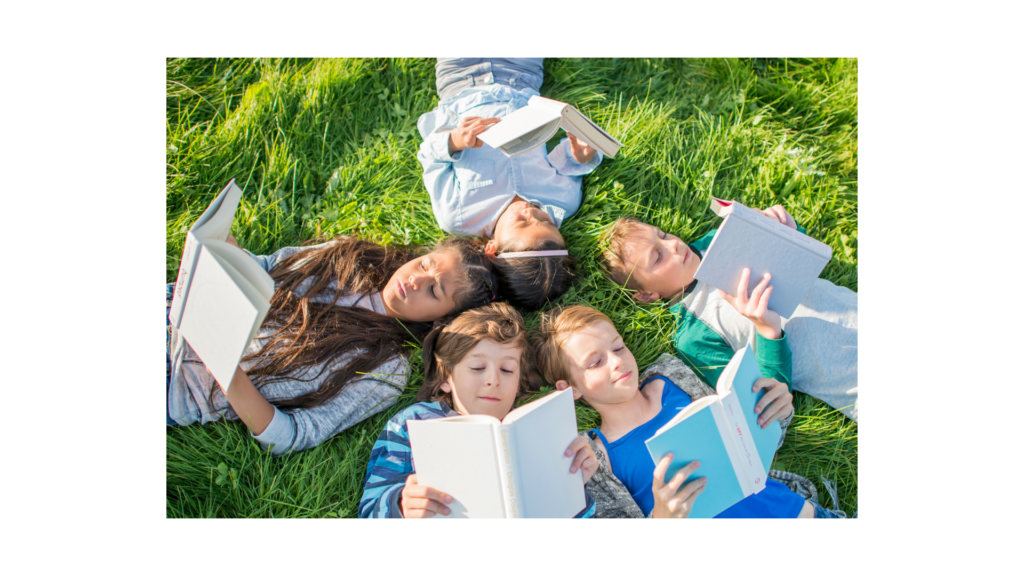 Children having a reading picnic in the summer.